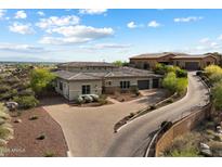 Luxury home with lush desert landscaping, mountain views and a private driveway at 6535 W Gold Mountain Pass, Phoenix, AZ 85083