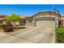 Charming single-story home with a two-car garage and basketball hoop at 12416 W Midway Ave, Glendale, AZ 85307
