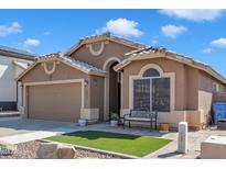 Charming single-story home with a well-manicured front yard and a cozy bench, showcasing curb appeal at 18845 N 23Rd Pl, Phoenix, AZ 85024