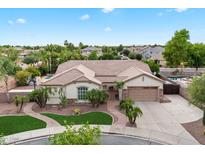 Expansive desert home featuring a tile roof, two car garage, and mature landscaping at 19902 S 190Th St, Queen Creek, AZ 85142