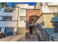 Multi-level building featuring brick accents, individual garages, and well-maintained landscaping at 3302 N 7Th St # 344, Phoenix, AZ 85014