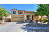 Charming two-story home featuring a well-manicured front yard and a two-car garage at 3788 E Sexton St, Gilbert, AZ 85295