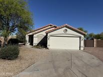 Charming single-story home featuring a two-car garage and low maintenance landscaping at 1120 S Valley Dr, Apache Junction, AZ 85120