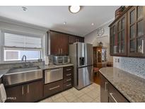 Modern kitchen featuring stainless steel appliances and granite countertops at 17200 W Bell Rd # 1748, Surprise, AZ 85374