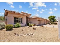 Charming single-story home boasting a desert-landscaped front yard and a spacious three-car garage at 1943 E Drake Dr, Tempe, AZ 85283