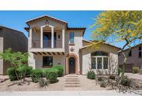 Charming two-story home with desert landscaping, balcony, and a welcoming front entrance at 2418 W Jake Hvn, Phoenix, AZ 85085