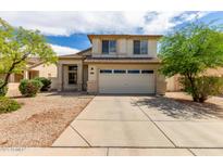 Charming two-story home with neutral paint, two car garage, and desert landscaping at 4245 E Shannon St, Gilbert, AZ 85295