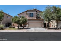 Charming two-story home with a two-car garage and well-maintained landscaping at 44328 W Knauss Dr, Maricopa, AZ 85138