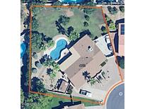 Aerial view of property featuring a pool, mature landscaping, privacy wall and a well-maintained grassy backyard at 4442 E Redfield Rd, Phoenix, AZ 85032