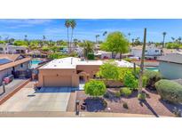Aerial view of the property highlighting landscaping, two-car garage, and residential neighborhood at 6401 N 82Nd Way, Scottsdale, AZ 85250