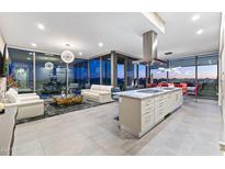 Bright open-concept living space featuring tile flooring, modern furnishings, and panoramic city views at 7180 E Kierland Blvd # 1218, Scottsdale, AZ 85254