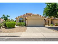 Well-maintained single-story home with a two car garage and desert landscaping at 8331 E Plata Ave, Mesa, AZ 85212
