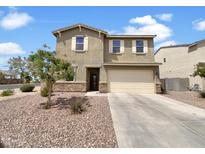 Charming two-story home with a neutral-colored exterior and a well-maintained front yard with desert landscaping at 7146 E Bobwhite Ct, San Tan Valley, AZ 85143