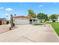 Charming single-story home with a well-manicured front yard, two car garage and desert landscaping at 7648 N Via Del Paraiso --, Scottsdale, AZ 85258
