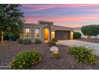 Charming single-story home with a well-manicured front yard and desert landscaping at 12780 W Desert Vista Trl, Peoria, AZ 85383
