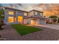 Beautiful two-story home boasts lush artificial turf, rock landscaping, and a wide driveway at 2754 E Michelle Way, Gilbert, AZ 85234