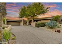 Stunning desert home featuring a large tree, mature landscaping, and a private driveway at 41590 N 108Th St, Scottsdale, AZ 85262