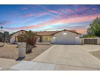 Charming single-story home with a well-maintained lawn and a spacious driveway at 5225 E Hearn Rd, Scottsdale, AZ 85254