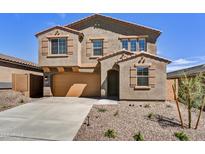 Two-story home with a two car garage, desert landscaping, and a concrete driveway at 13294 W Eagle Feather Rd, Peoria, AZ 85383