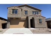 Beautiful two-story home with a two-car garage, desert landscaping, and neutral colors at 13294 W Eagle Feather Rd, Peoria, AZ 85383