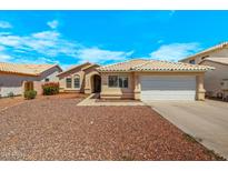 Charming single-story home with a well-maintained front yard and a two-car garage at 16240 W Maricopa St, Goodyear, AZ 85338