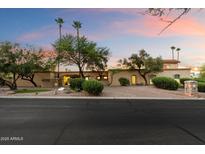 Spacious single-story home with mature trees, desert landscaping, and a circular driveway at 4744 E Foothill Dr, Paradise Valley, AZ 85253