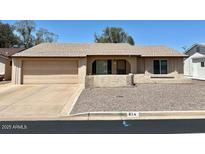 Single story home features a spacious garage, desert landscaping, and a neutral color palette at 814 S 80Th St, Mesa, AZ 85208