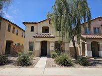 Charming two-story home with a well-maintained yard and a beautiful desert tree in a desirable neighborhood at 9137 W Coolbrook Ave, Peoria, AZ 85382
