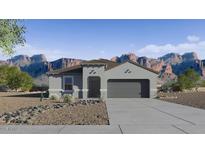 Charming single-story home showcasing a desert landscape and mountain views at 1320 W Kennedy Ave, Coolidge, AZ 85128