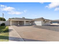 Charming home featuring a covered parking area and sizable concrete driveway at 1658 N Old Colony Dr, Mesa, AZ 85201