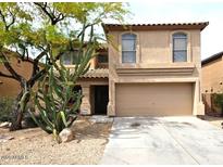Charming two-story home featuring desert landscaping, a two-car garage, and a covered entryway at 2514 W Big Oak St, Phoenix, AZ 85085
