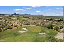 Picturesque golf course with lush green fairways and sand traps, set against a backdrop of mountains and desert landscape at 34457 N Legend Trail Pkwy # 1013, Scottsdale, AZ 85262