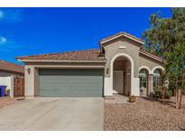 Charming single-story home showcasing a well-maintained yard, and a two-car garage at 4377 S Soboba St, Gilbert, AZ 85297