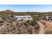 This well-maintained home offers desert views and easy access to hiking trails at 49039 N 24Th Ave, New River, AZ 85087
