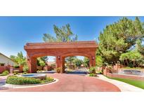 Impressive brick entrance to Gilbert Heights, featuring manicured landscaping and a decorative fountain, exudes exclusivity at 541 E Spur Ave, Gilbert, AZ 85296