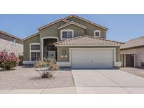 Charming two-story home with a tile roof and a two-car garage, set in a well-maintained neighborhood at 1079 E Jasper Dr, Gilbert, AZ 85296
