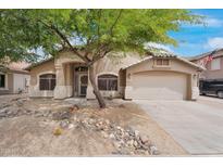 Charming single-story home with desert landscaping and a mature shade tree in the front yard at 418 E Clairidge Dr, San Tan Valley, AZ 85143