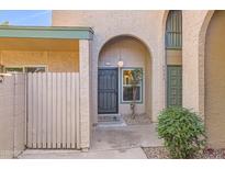 Charming home featuring an arched entryway, desert landscaping, and a welcoming front door at 4531 W Continental Dr, Glendale, AZ 85308
