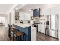 Charming kitchen with stainless steel appliances, modern finishes, and a breakfast bar for casual dining at 7445 E Eagle Crest Dr # 1145, Mesa, AZ 85207