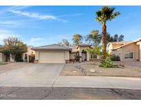 Charming single-story home featuring desert landscaping, tile roof, and attached two-car garage at 1120 E Harbor View Dr, Gilbert, AZ 85234