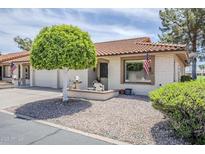 Charming single-story home featuring a desert landscape, front patio, and a well-maintained exterior at 2311 S Farnsworth Dr # 81, Mesa, AZ 85209