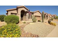 Charming single-story home showcasing desert landscaping and a welcoming front entrance at 26624 N 41St St, Cave Creek, AZ 85331