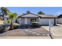 Charming single-story home features brick accents, a well-manicured yard, and a two-car garage at 3711 S Judd St, Tempe, AZ 85282