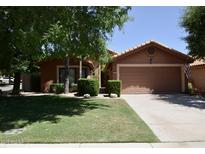 Charming single-story home featuring a well-maintained lawn and a two-car garage, in a suburban neighborhood at 12965 N 95Th Way, Scottsdale, AZ 85260