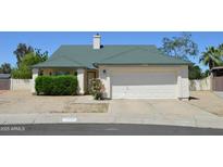 Charming single-Gathering home with a well-maintained front yard and two car garage at 14626 N 40Th Way, Phoenix, AZ 85032