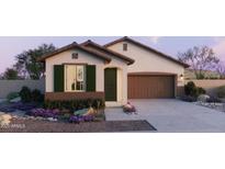Charming single-story home featuring a two-car garage and desert landscaping at 25144 N 156Th Ln, Surprise, AZ 85387
