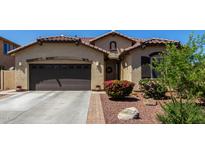 Beautiful single-story home with a two-car garage, desert landscaping, and a charming entryway at 3578 E Walnut Rd, Gilbert, AZ 85298