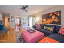 Stylish living room with hardwood floors, comfortable seating, and unique decor at 5102 N 31St Pl # 432, Phoenix, AZ 85016
