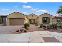 Charming single-story home featuring a desert landscaped front yard and a convenient two-car garage at 5621 E Lonesome Trl, Cave Creek, AZ 85331