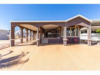 Inviting home featuring a covered carport and charming front porch area at 17200 W Bell Rd # 1202, Surprise, AZ 85374